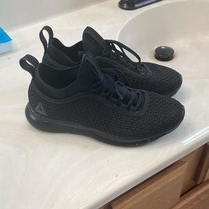 Black Reebok woman’s shoe